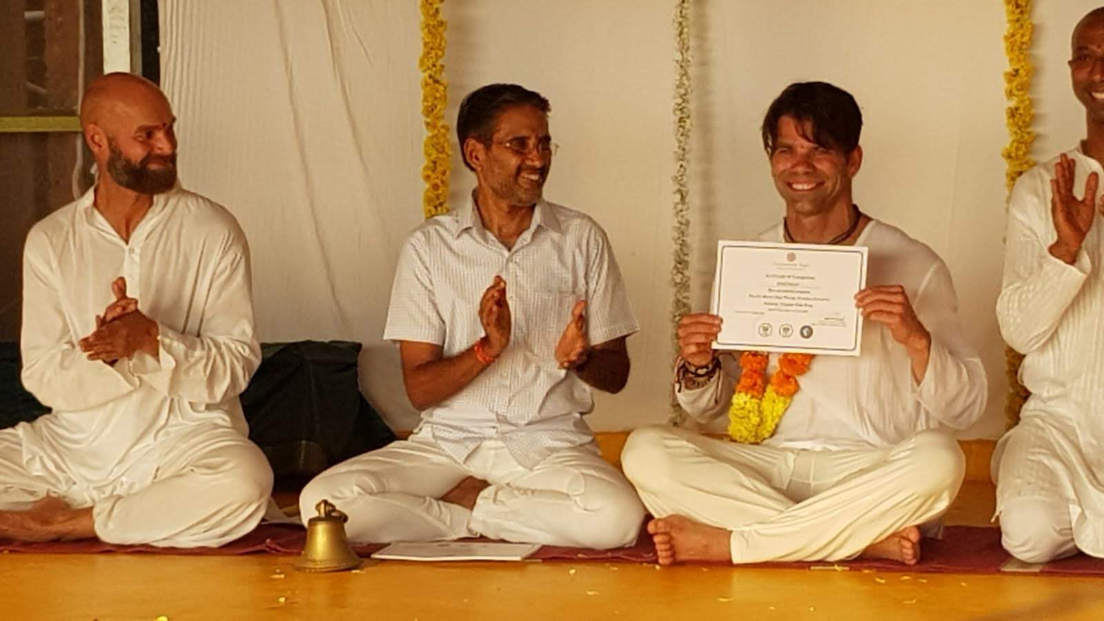 Group of men celebrating certificate achievement.